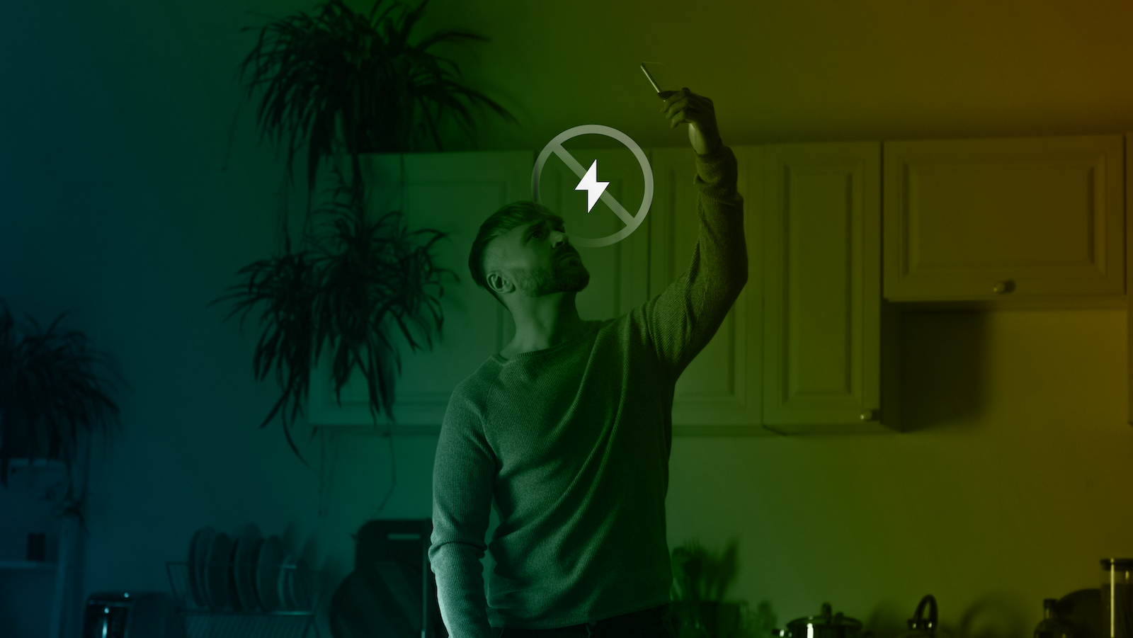 Person checking phone signal during power outage.