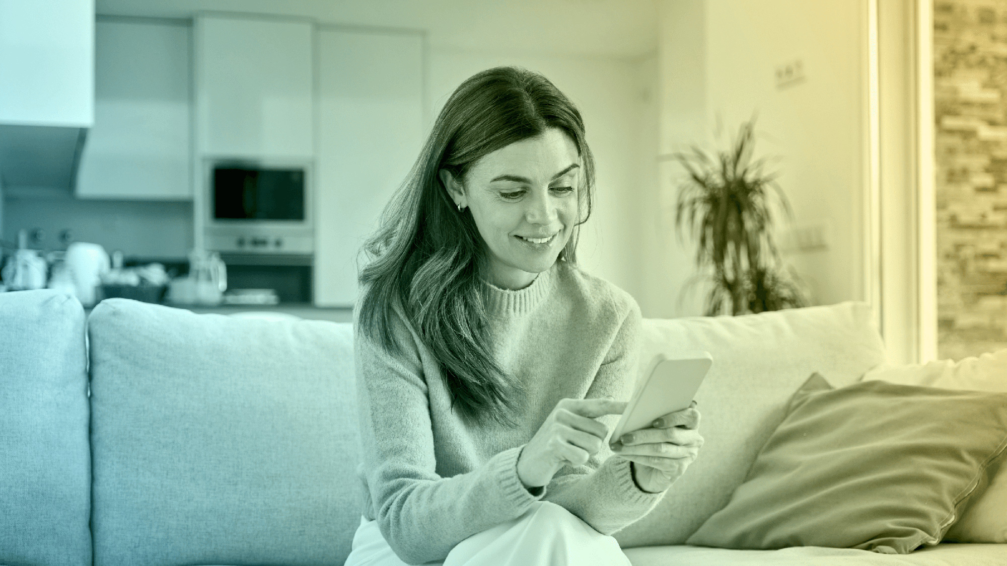 Woman using phone to manage prepaid electricity plan.