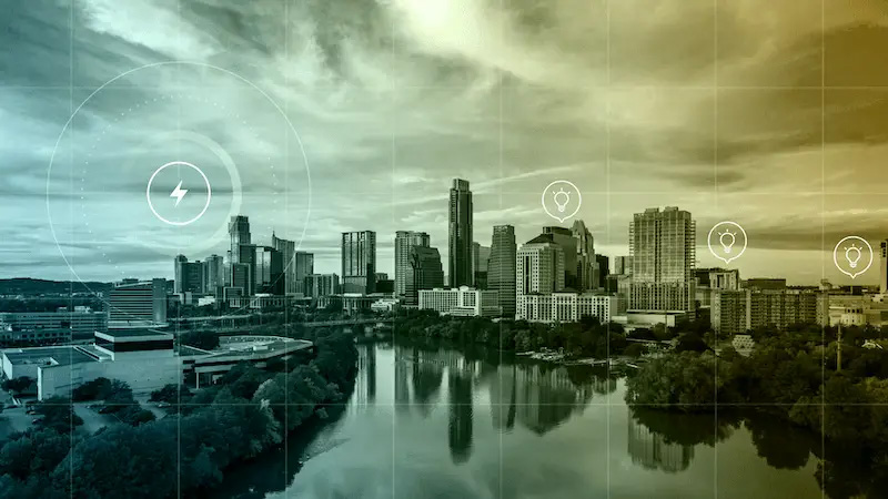 Cityscape of Austin, Texas, reflected in the river under a cloudy sky, overlaid with digital energy icons representing electricity and innovation.